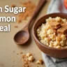 A warm and inviting bowl of brown sugar cinnamon oatmeal, perfect for a cozy breakfast or snack, with a rustic wooden spoon and a sprinkle of brown sugar.