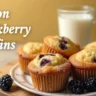 A warm and inviting plate of freshly baked lemon blackberry muffins, perfect for breakfast or brunch.