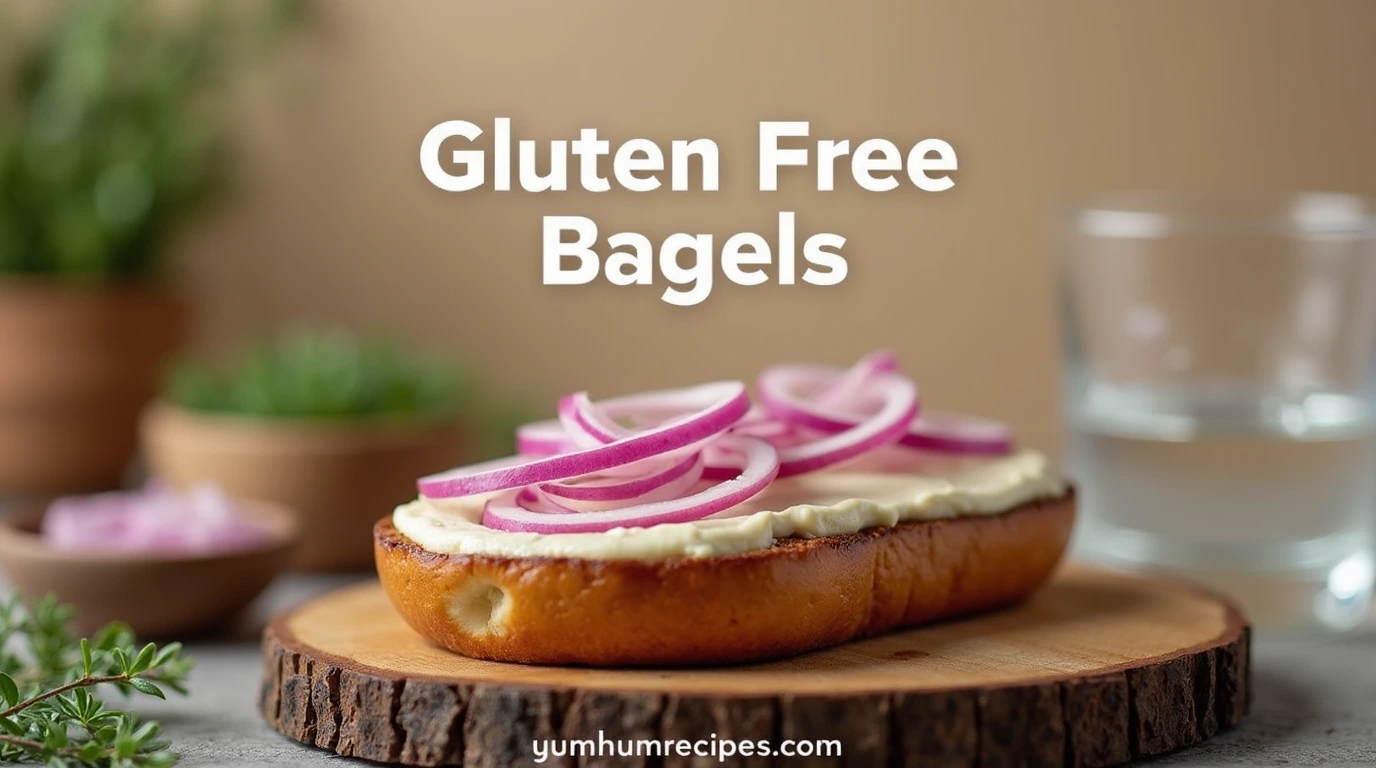 A perfectly toasted gluten free bagel with cream cheese and red onion, featuring the title "Gluten Free Bagels" and a rustic wooden cutting board.