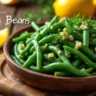 Freshly cooked pole beans with herbs and lemon, showcasing a healthy and tasty dish